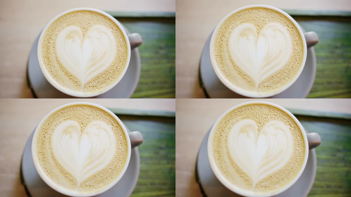 一个画着心形的咖啡泡沫的近距离垂直视图