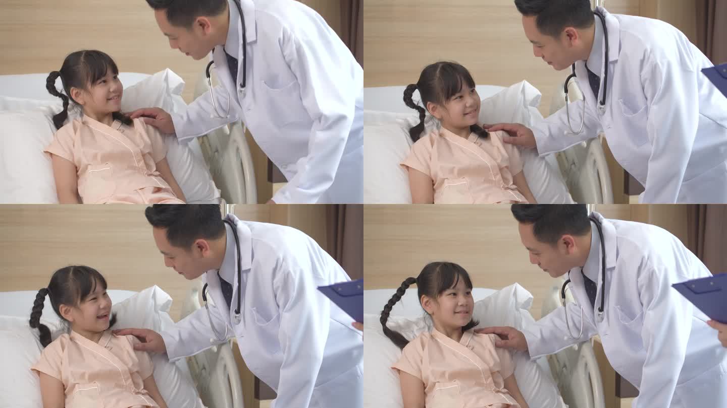 亚洲男医生和女护士交谈和安慰一个生病的小女孩