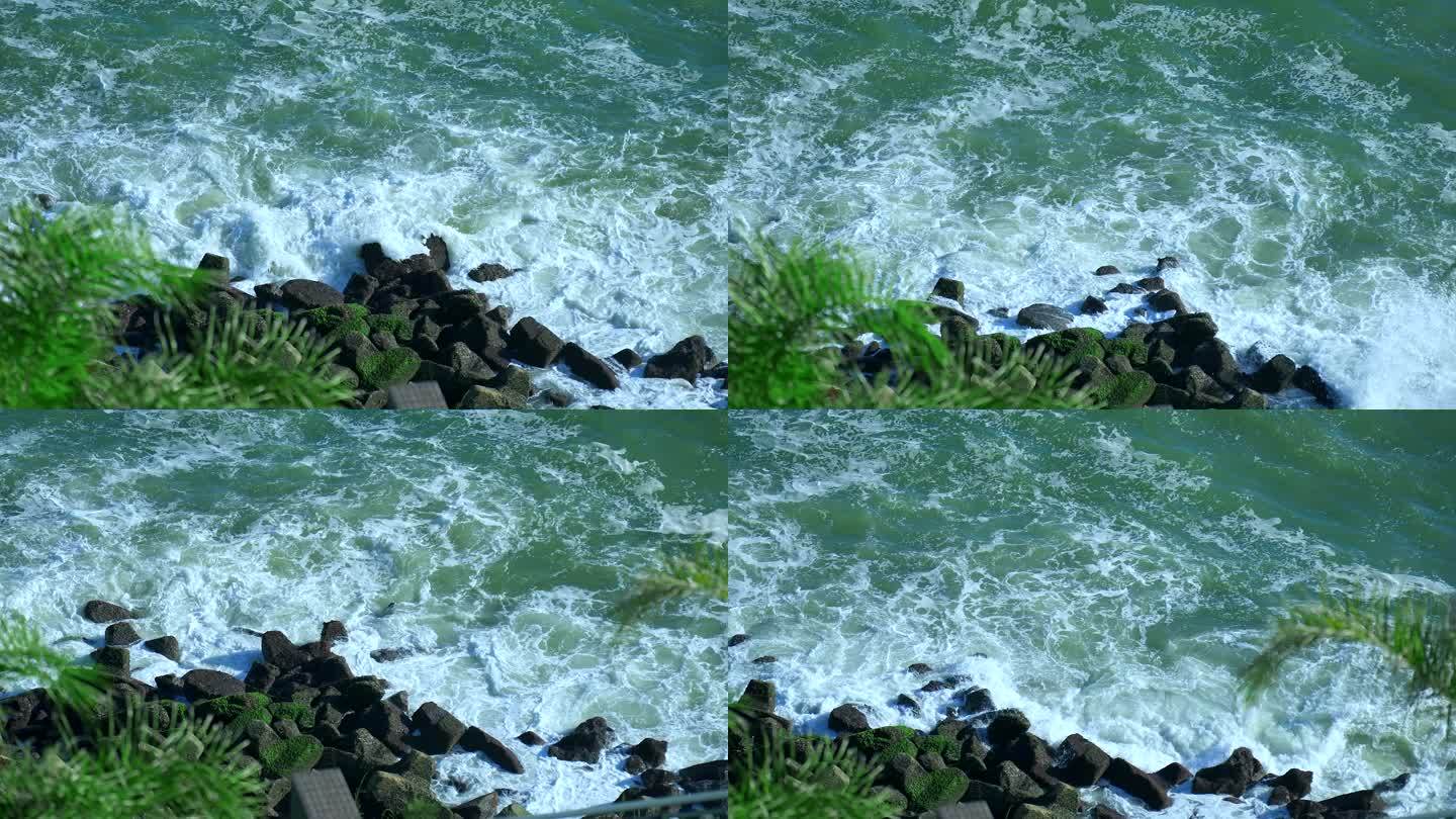 4K升格实拍海岸边潮水拍打礁石激起浪花