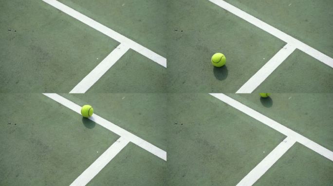 网球在球场上滚动着停了下来