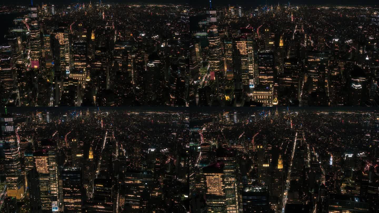 纽约市和曼哈顿全景天际线的航拍镜头与地标摩天大楼的建筑在晚上。直升机俯瞰城市景观和高耸的旅游景点