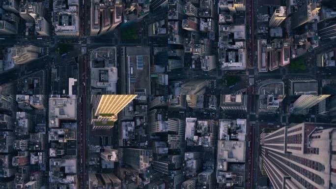 自上而下鸟瞰纽约市街道与可见网格系统，商业和住宅建筑屋顶。繁忙的都市交通，汽车，黄色出租车，商用车辆