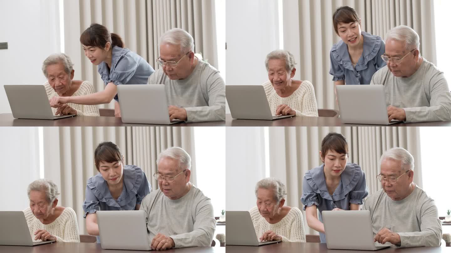 一个美丽善良的年轻亚洲护士教老年人使用电脑。