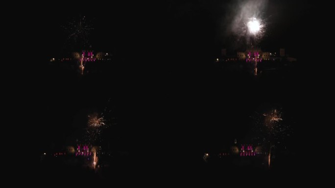 电影空中无人机拍摄的轨道周围美丽的烟花在晚上与旧的大意大利别墅别墅乡村别墅为背景。五彩缤纷的灯光伴随