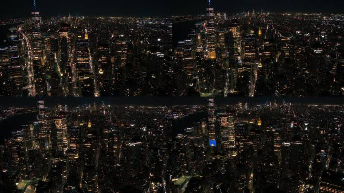 纽约曼哈顿大道航拍夜景，商业和住宅建筑屋顶，汽车和商用车辆夜间行驶。直升机查看一条笔直的道路与交通