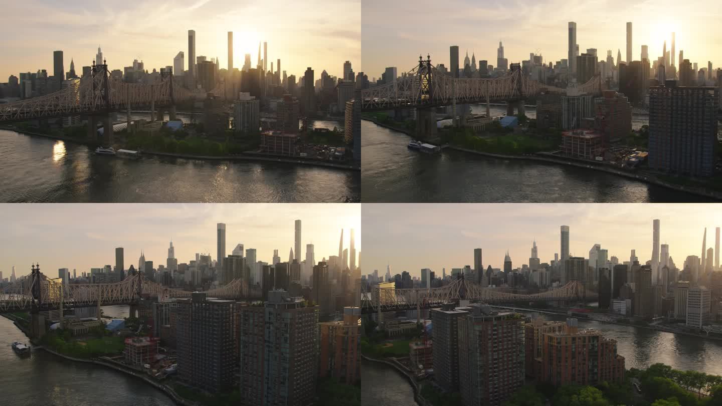 傍晚的纽约市东河景观，上东区摩天大楼和埃德·科赫·昆斯伯勒大桥。电影城市天际线与日落和薄云的天空