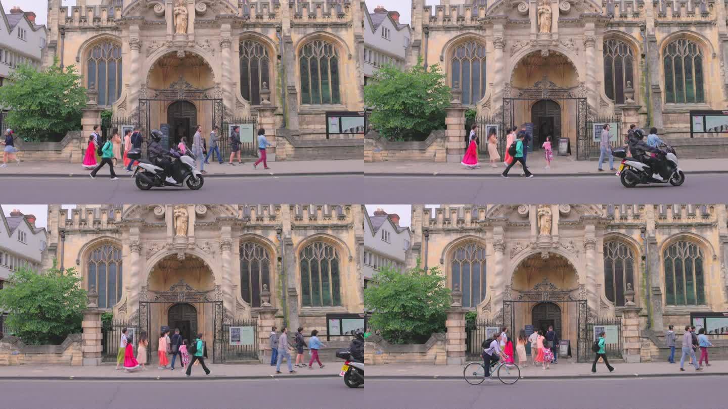 英国牛津，游客沿着大街和圣母玛利亚大学教堂散步