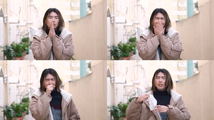 一名台湾男子在冬天用纸巾擤鼻涕、咳嗽、打喷嚏。