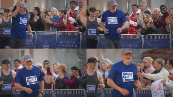 一名老年男性慢跑者在城市马拉松比赛中奔跑并受到观众欢呼的慢动作肖像。健康健美的老人享受体育活动，保持