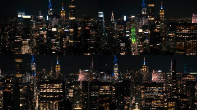 曼哈顿中城建筑夜景鸟瞰图。从直升机上拍摄的金融商业区晚间画面。历史悠久的办公大楼，包括灯火通明的帝国
