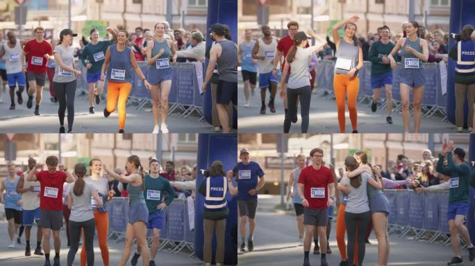 妇女支持妇女:参加马拉松比赛的快乐女选手肖像。一群朋友一起庆祝，互相祝贺越过终点线
