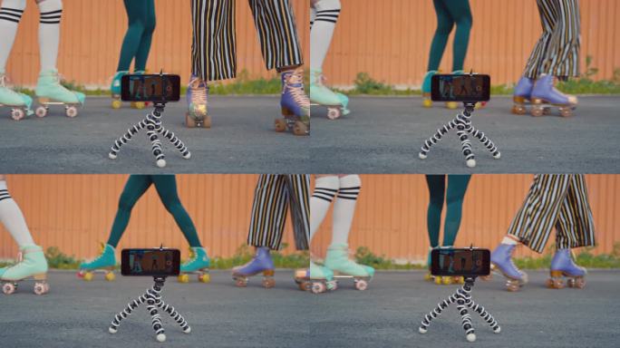 三个女性朋友在四轮溜冰鞋上做同步动作