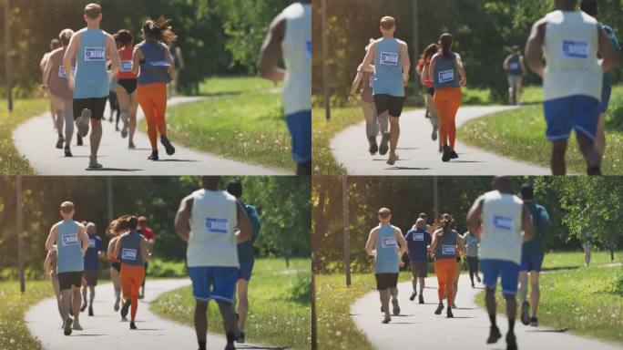 广泛的后视镜不同的马拉松参赛者竞争的比赛终点线:一群人通过公园健康步道和参与马拉松奉献