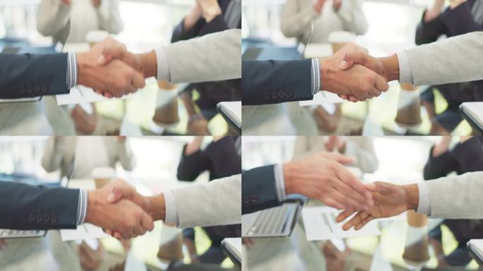 掌声，合作伙伴握手和商务人士在办公室庆祝合并交易或b2b合作。欢迎、感谢和全体员工握手并鼓掌祝贺。