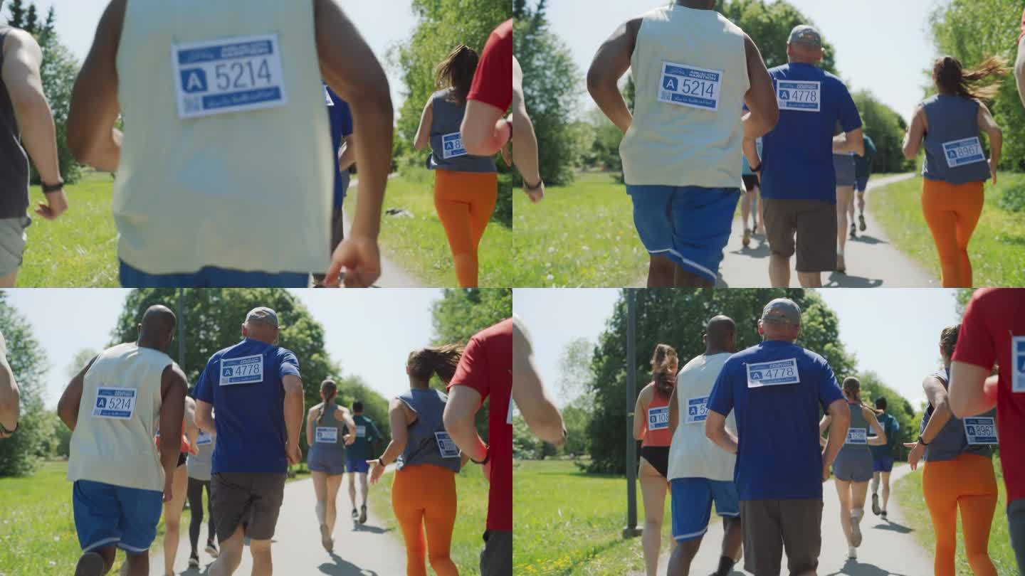 慢动作后视图:一群不同的人参加马拉松和穿过公园小径的肖像。活跃的老年人与年轻的慢跑者竞争，保持健康