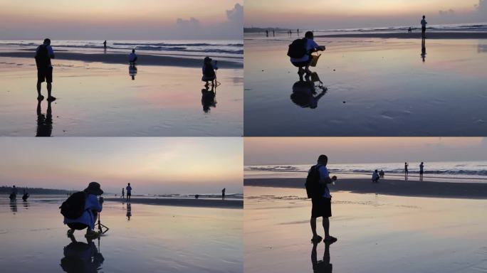 海边日出人物剪影海边人物戏水游玩沙滩夕阳