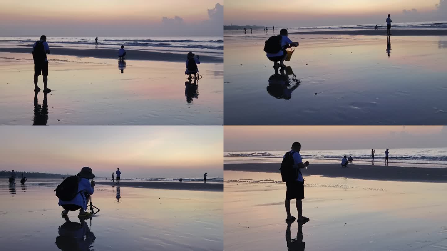 海边日出人物剪影海边人物戏水游玩沙滩夕阳
