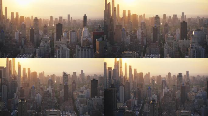 纽约曼哈顿住宅和办公建筑的鸟瞰图。全景傍晚日落镜头从直升机。市中心中央公园附近的摩天大楼城市景观