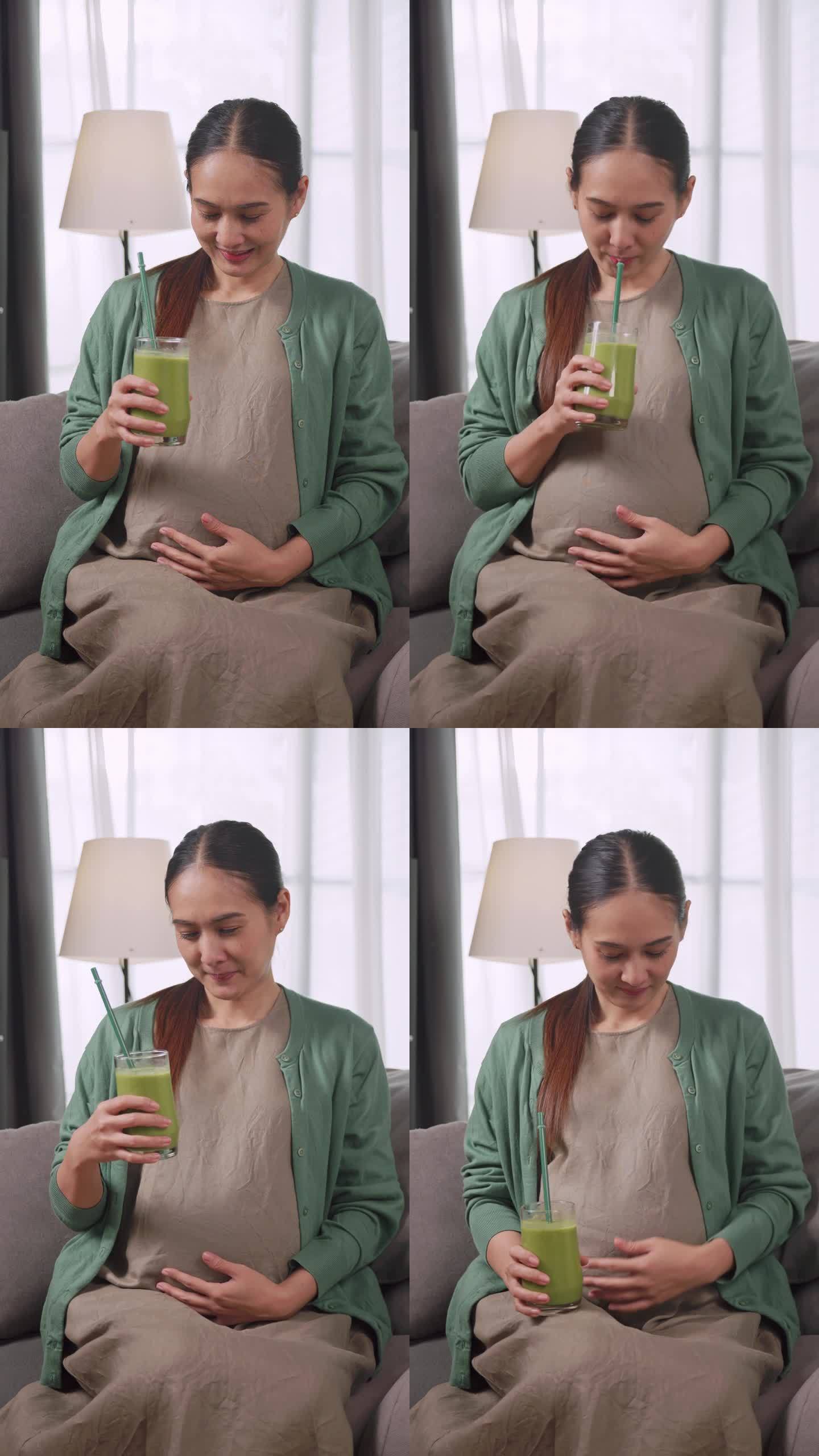 垂直夹。亚洲孕妇为了自己和胎儿的健康饮用蔬菜汁。