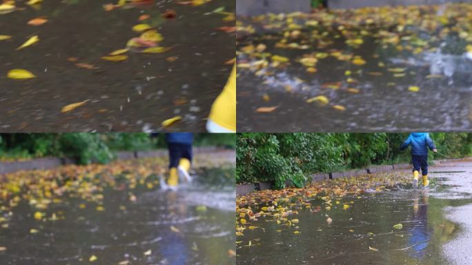 穿着黄色橡胶靴在水坑里奔跑的蹒跚学步的孩子或男孩。