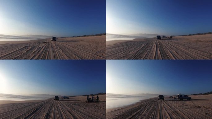加州的夏天:POV驾驶在太平洋海岸的海滩上