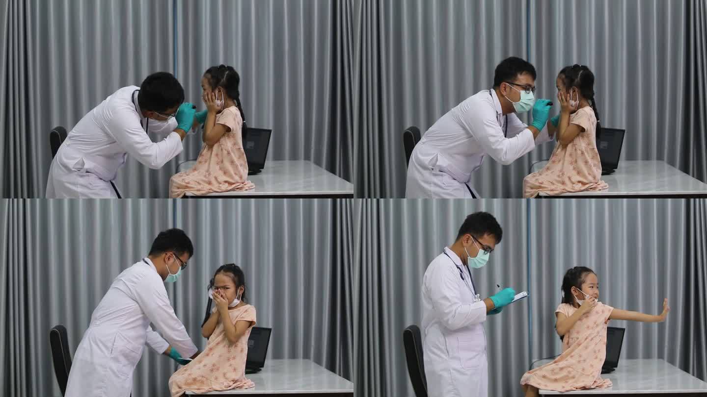 专业医生用听诊器检查小孩，年轻的亚洲母亲在咨询医生的同时密切安慰小女儿。