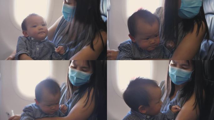 家庭旅行:亚洲母亲在飞机上照顾儿子-用餐时间的乐趣。