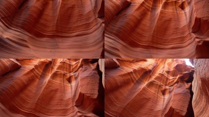 低角度观看亚利桑那州羚羊峡谷高大的红色砂岩岩层的景色