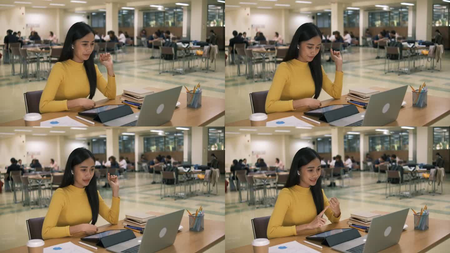亚洲女孩在线学习课堂学习在线视频呼叫zoom老师，快乐亚洲女孩在线学习英语笔记本电脑。