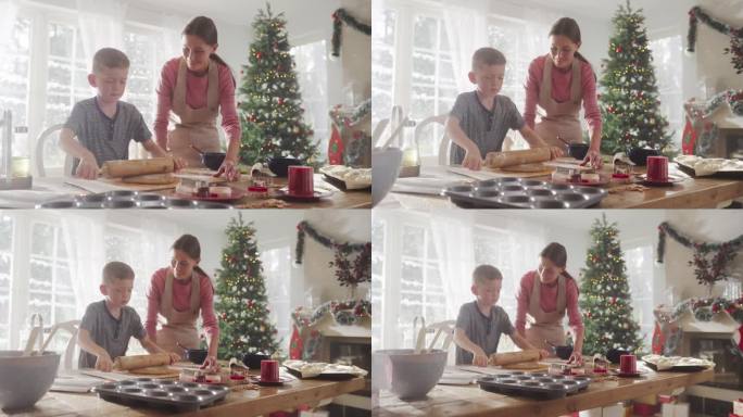 慢动作肖像的母亲和儿子准备烤姜饼在圣诞节。可爱的小男孩帮妈妈做家务和做饭，一起度过假期