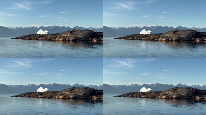 从格陵兰斯科斯比松德丹麦岛上看到的海湾静态景观和孤独的冰山。