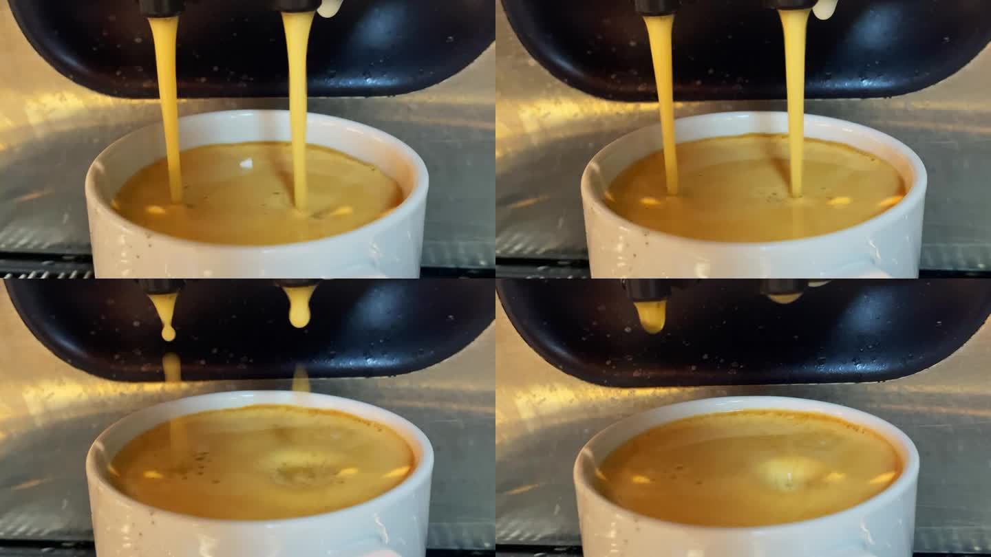 咖啡落入白色的陶瓷杯中。慢镜头和近景。4k剪辑库存视频