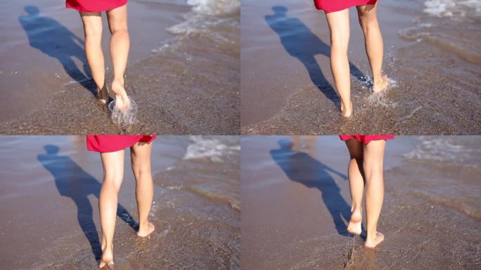 细细的女性腿沿着海岸走，特写