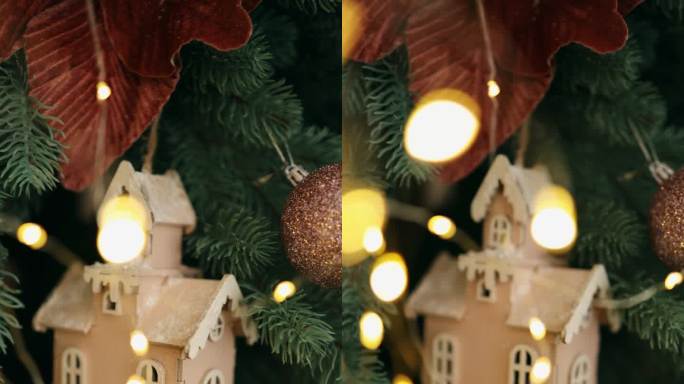圣诞树上挂着发光的花环的玩具木屋。垂直视频