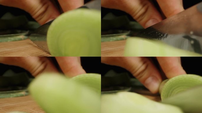 当镜头向后移动时，我正在切韭菜。微距小车拍摄。