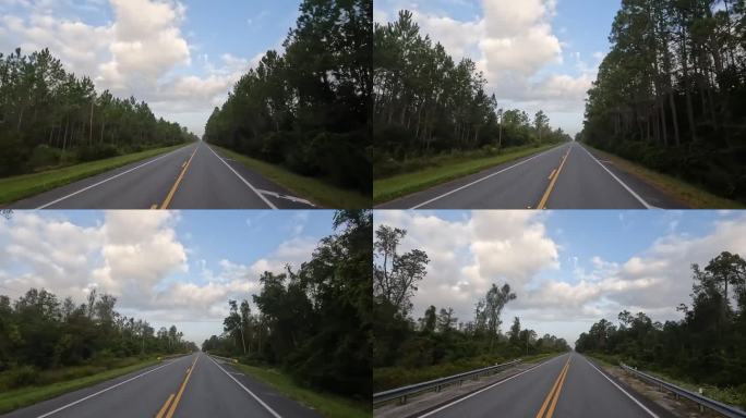 黎明时分，司机沿着一望无际的空旷笔直的道路行驶，穿过低洼的松林，头顶上飘着一块块浮云