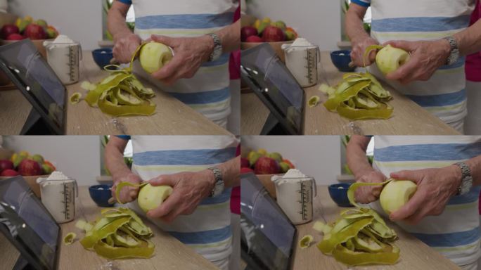 老人削苹果皮做苹果派