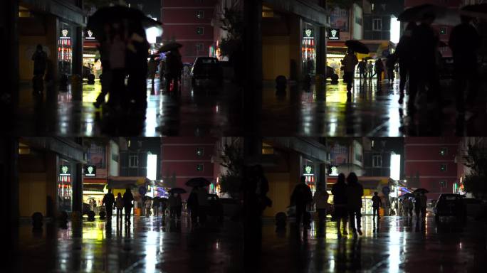 下雨的夜晚   城市行人打着伞下班回家