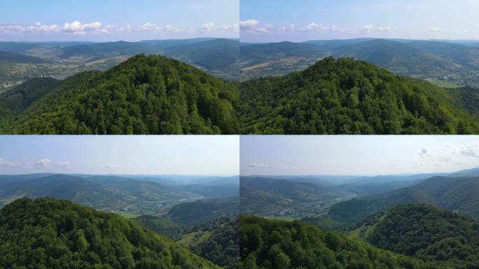 Сinematic斯洛文尼亚南部连绵不绝的山脉和森林鸟瞰图。无人机飞过森林
