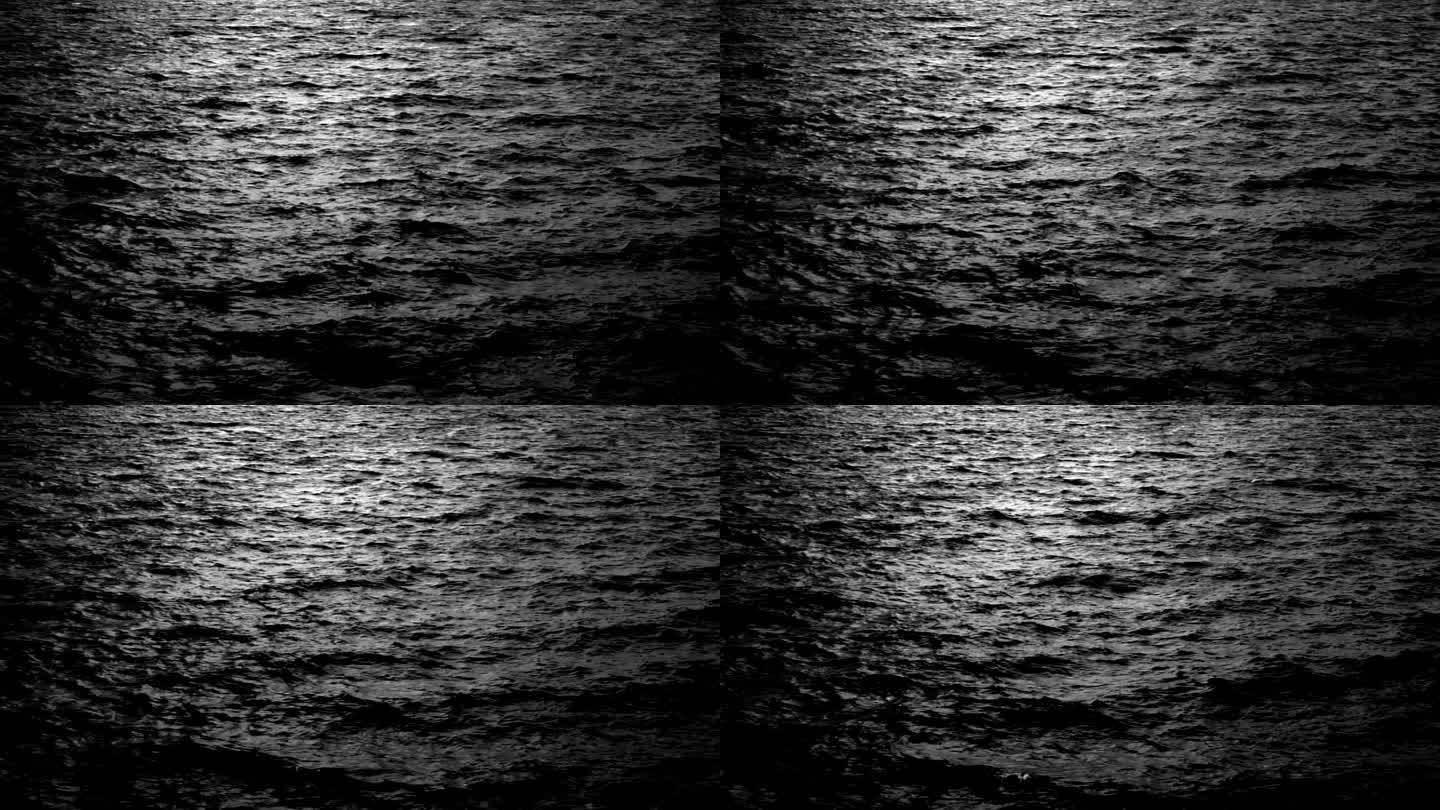 海水在月光下荡起涟漪。海浪上闪烁着明亮的光芒。夜生活，静观场景，黑暗，黄昏，傍晚，魔幻，水，湿，自然