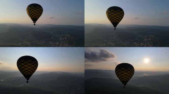 日出时热气球飞越高山