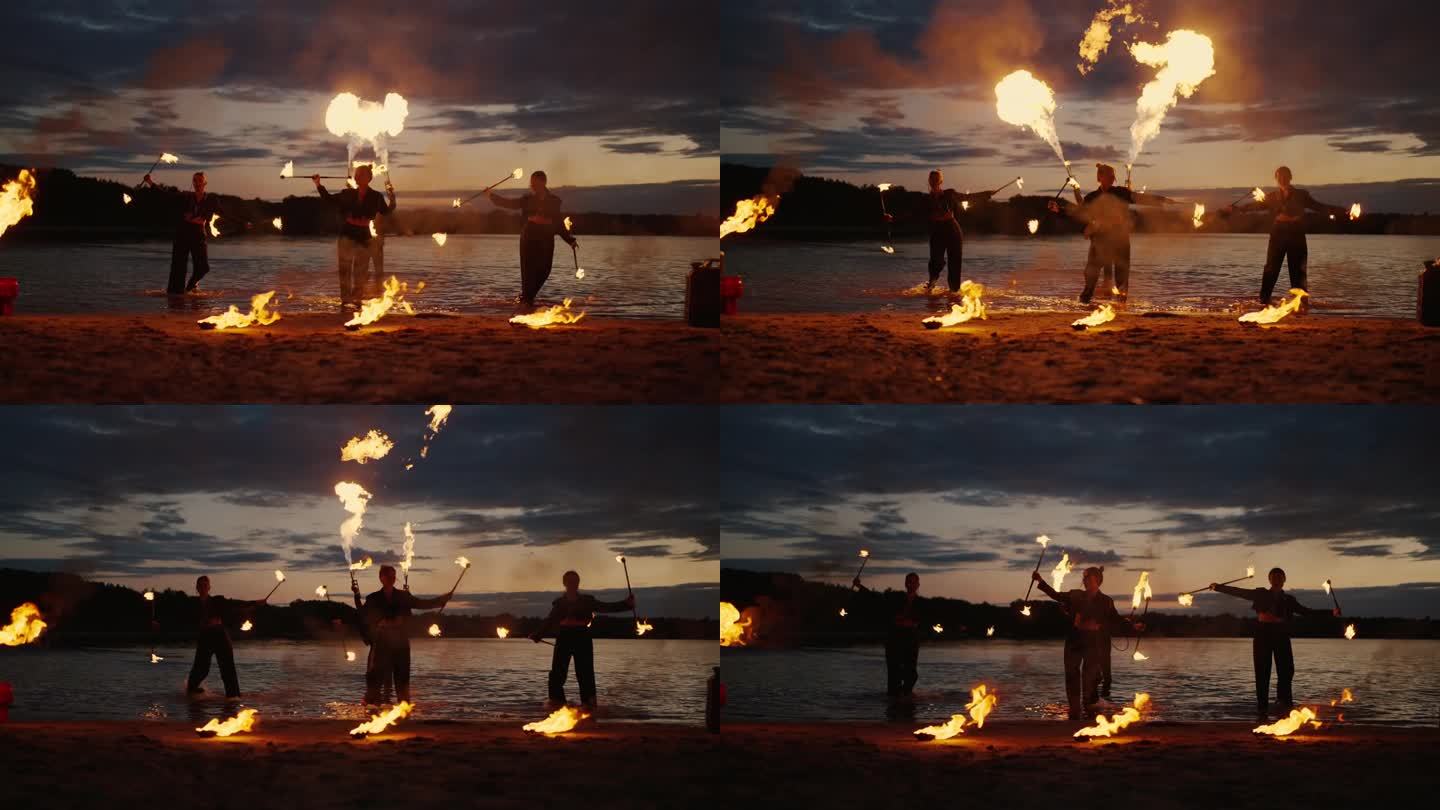 神秘的火表演，湖岸夜景水火秀，剪影
