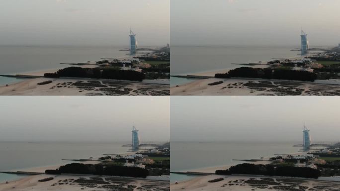 迪拜波斯湾海滩上的阿拉伯塔酒店的航拍画面，4k