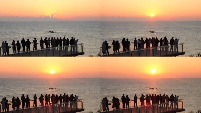 威海市环翠区猫头山观景台上看日出的人群
