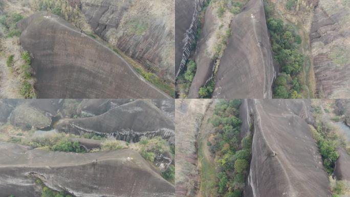 航拍男人站在山脊高椅岭刀背山顶悬崖峭壁