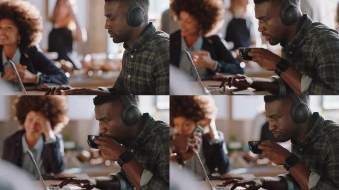 年轻的非洲裔美国人在咖啡馆使用笔记本电脑上网浏览检查电子邮件信息享受喝咖啡听音乐在繁忙的餐馆工作