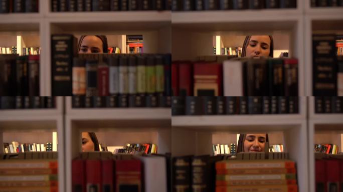 年轻女子在图书馆的展柜上看书