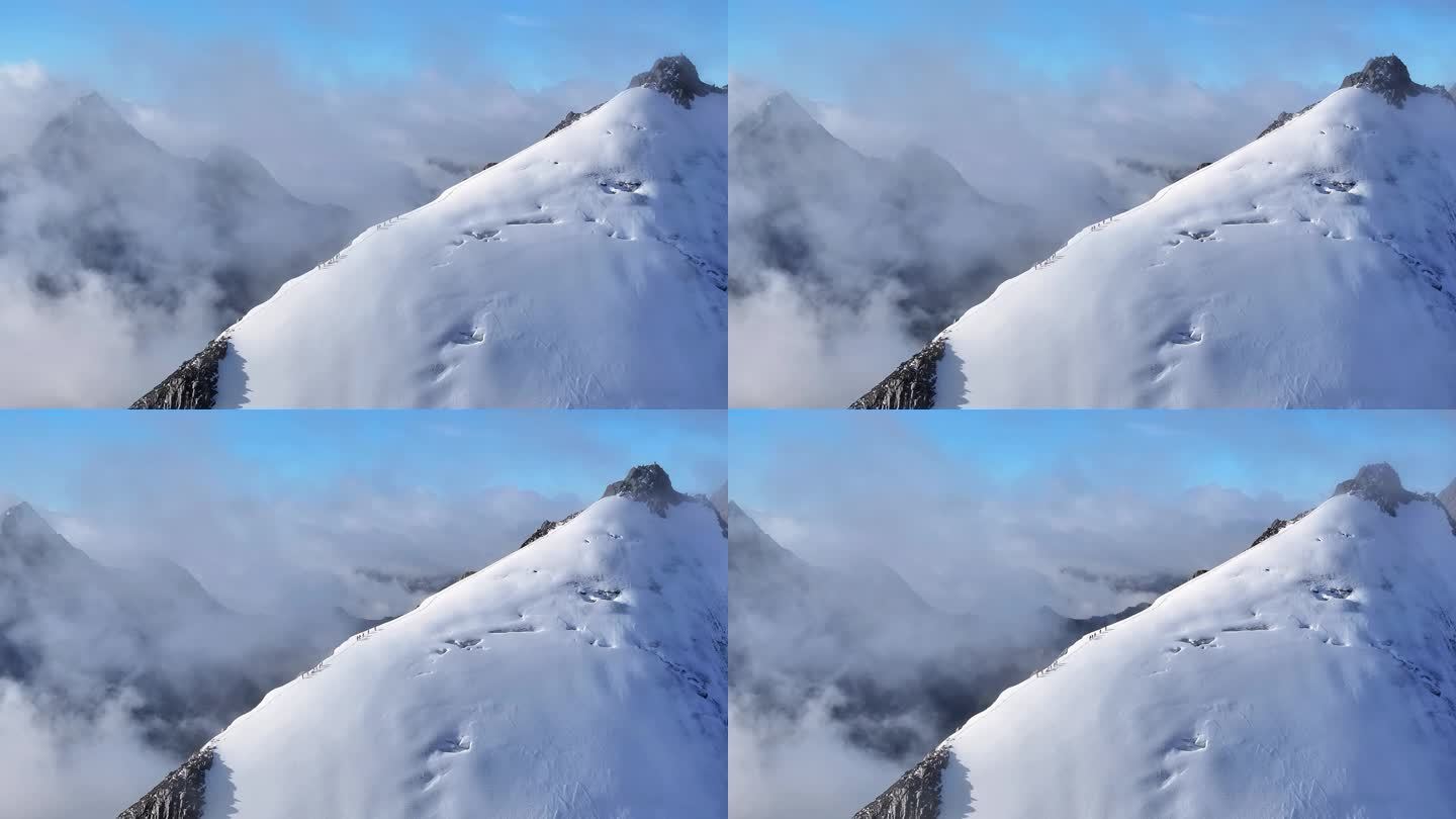 航拍川西贡嘎山区乌库楚雪山山脊上的登山者