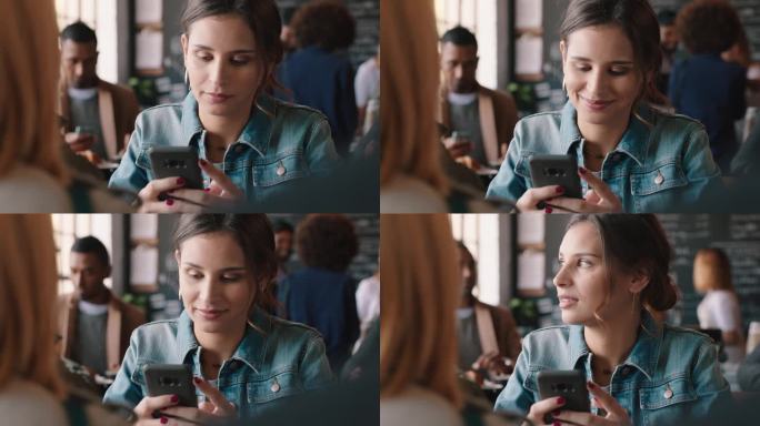 美女在咖啡馆用智能手机发短信，在社交媒体上分享信息，享受移动技术，在繁忙的餐厅等待