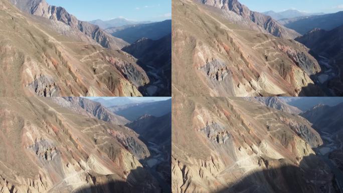 五彩缤纷的山脊上满是矿物，有一条细细的多风碎石路，采矿活动可见一斑